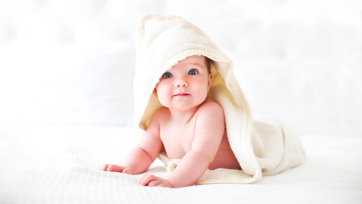 Cute Baby Wearing Bathrobe with Hood White Background