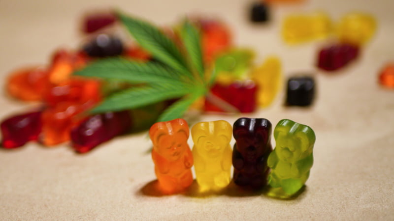 gummies bear and hemp leaf on a table