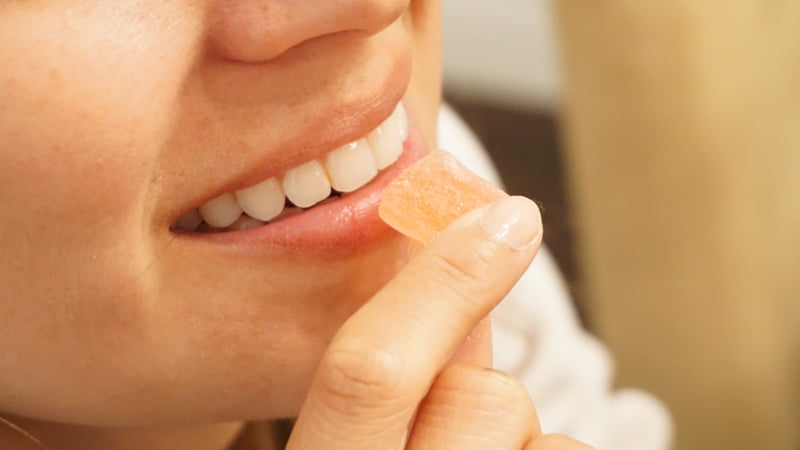 a girl eating gummies