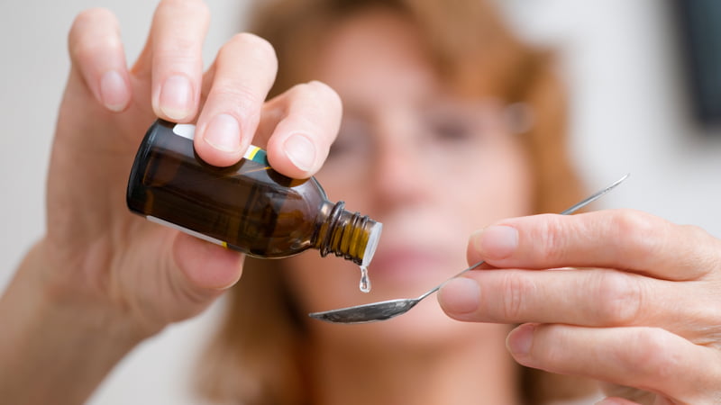 a lady measuring cbd