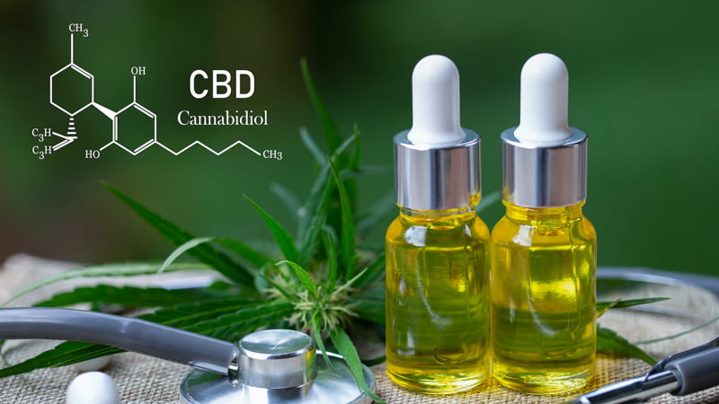 Two CBD Oil Bottles with Hemp Leaves and CBD Molecular Structure and Stethoscope