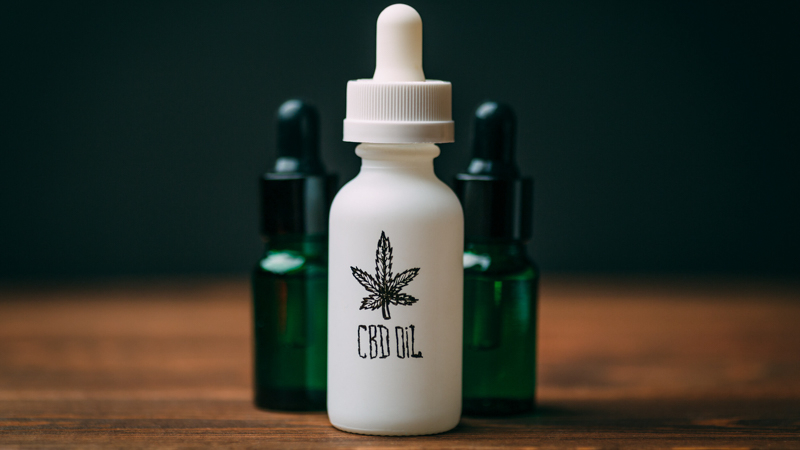 Three CBD Oil Bottles Standing on the Surface 