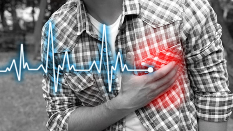 Person with AFib Holding His Chest with Difficulty