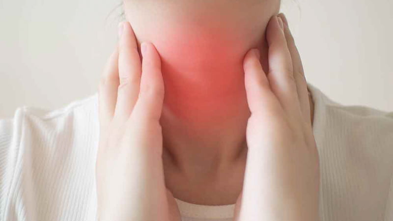 Hands Holding Inflamed Throat Area
