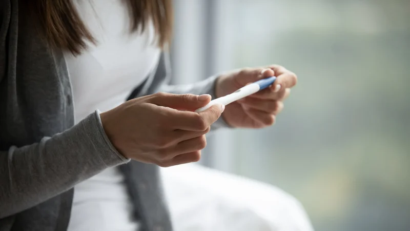 Woman Looking at the Pregnancy Test