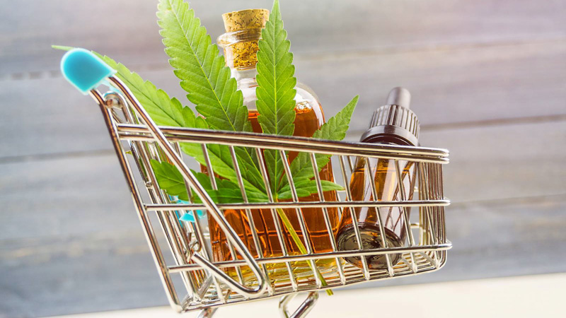 CBD Oil and Hemp Leaf in the Trolley