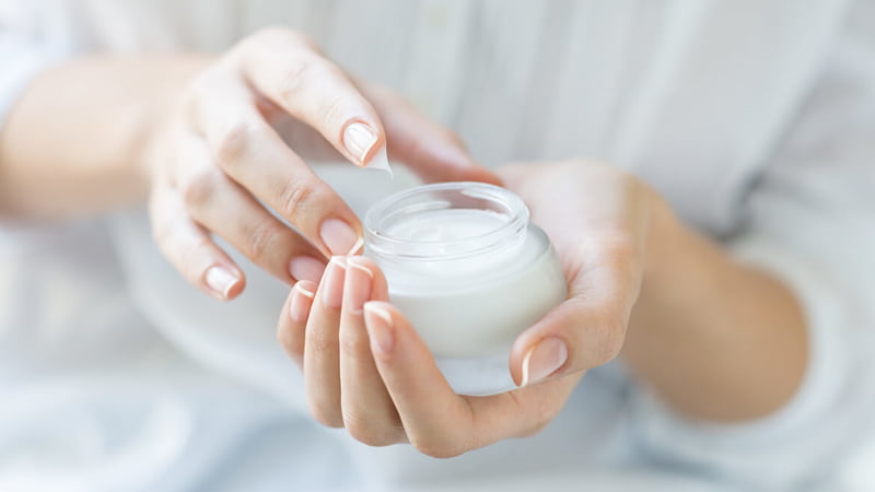 image of a woman using CBD Topical Cream