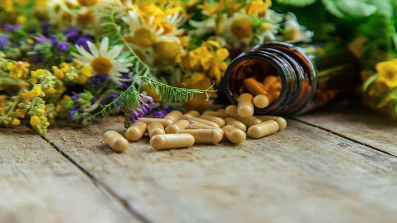 Flowers and Plants with pills on a table