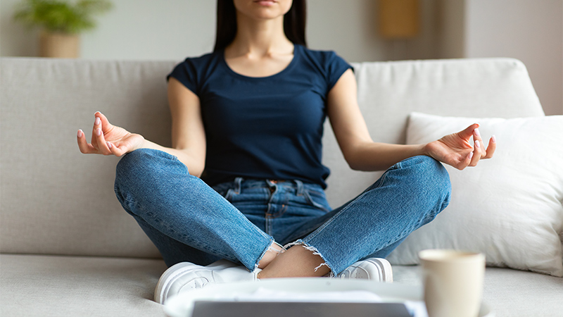 Woman Sitting and Meditating