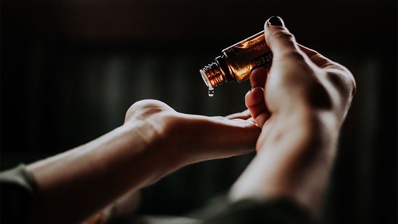 CBD Oil drops to hands