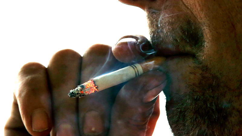 Man heavily smoking nicotine