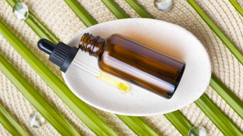 CBD oil bottle in a plate