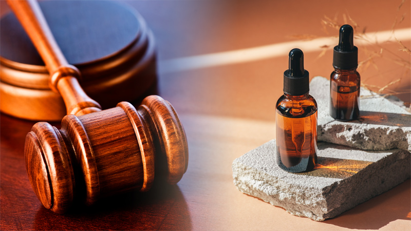 Image of a gavel and CBD oil bottles