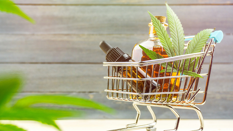 A push cart with CBD oil and hemp leaves