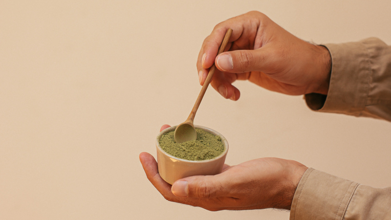 Image of a person mixing kratom strains
