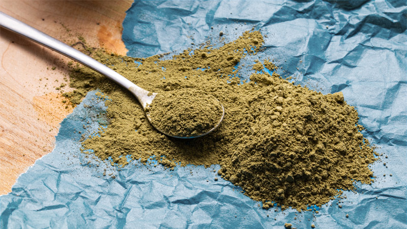 A pile of Red Malay Kratom and a spoon