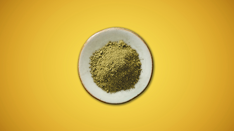 Image of Green Elephant Kratom in small plate with yellow background