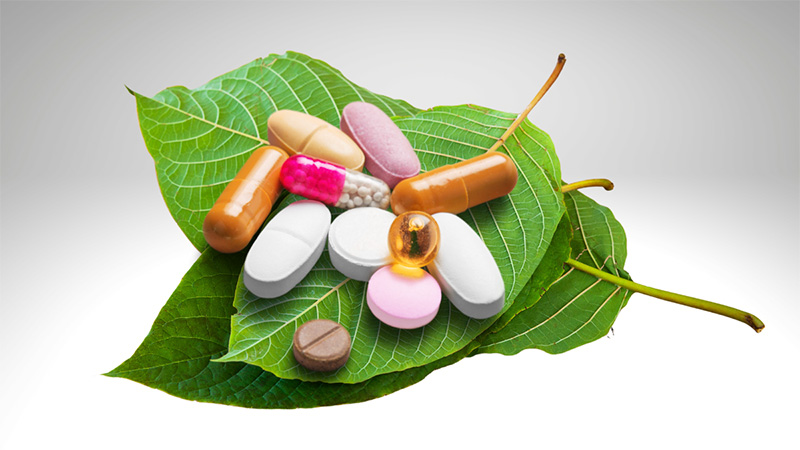 Kratom leaves with prescriptions medicines on top