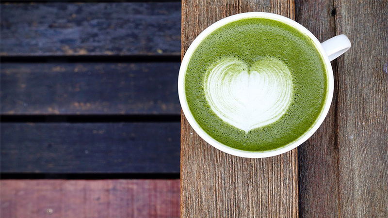 Kratom tea on cup in wood surface