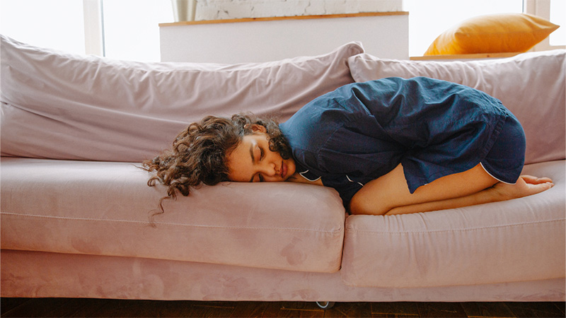 Woman lying on the couch on her back