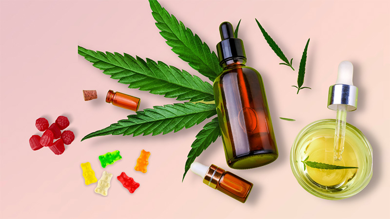 Different CBD products for anxiety in pink background
