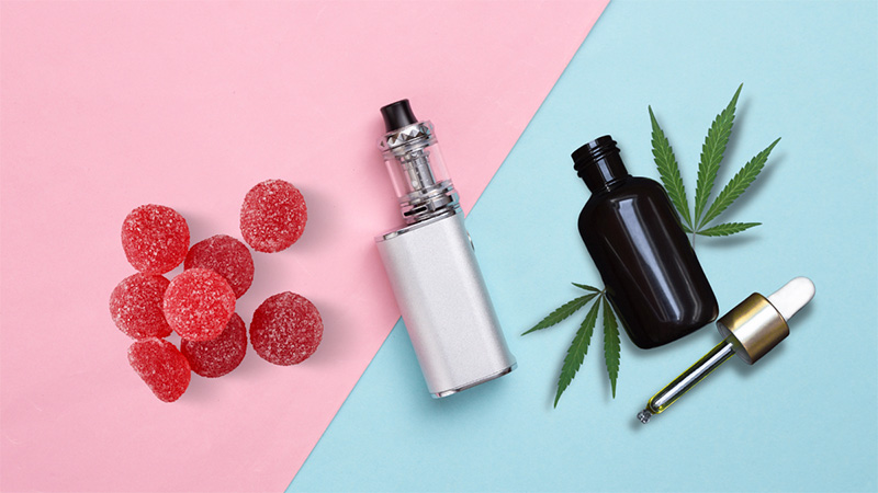 Delta 8 THC gummies, vape and tincture in pink and blue background